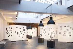 Expositions - Interior of a Modern Art Museum With Industrial Decorations Displaying Art Filled Walls